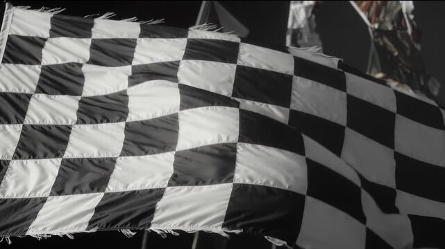 Racing flag with black white fabric texture waving at finish line