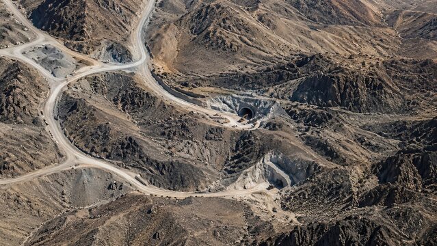 Aerial satellite view of Pickaxe Mountain in Iran, a spectacular rocky mountain landscape featuring rugged ridges, arid terrain, geological formations, remote wilderness, and varied topography