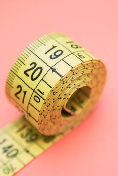 a rolled yellow measuring tape