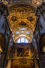 Richly decorated ceiling with paintings, gilding and stucco work of the Basilica di Santa Maria Maggiore in the upper town of Bergamo © Ldgfr Photos