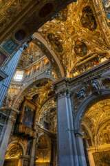 Richly decorated ceiling with paintings, gilding and stucco work of the Basilica di Santa Maria Maggiore in the upper town of Bergamo © Ldgfr Photos