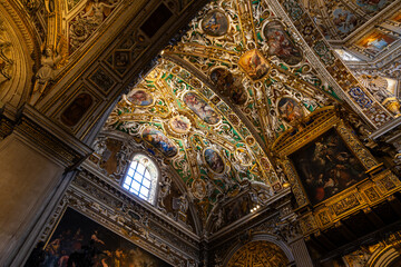 Richly decorated ceiling with paintings, gilding and stucco work of the Basilica di Santa Maria Maggiore in the upper town of Bergamo © Ldgfr Photos