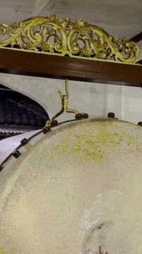 Close-up of traditional bedug drum with ornate carved frame