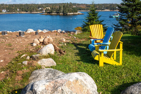 Adirondack chairs - Muskoka chairs, which are an iconic fixture throughout the historic coastal village of Peggy's Cove, Nova Scotia
