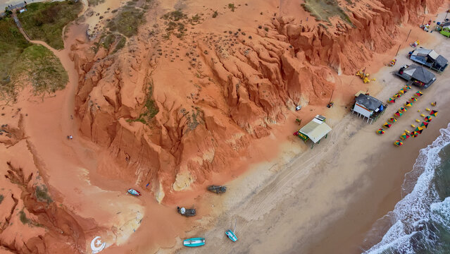Scenic overhead view of Canoa Quebrada beach destination and erosion canyons