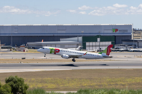 Tap air portugal embraer airplane taking off from runway