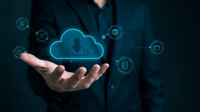 Businessman holding cloud computing icon with data storage and network symbols.