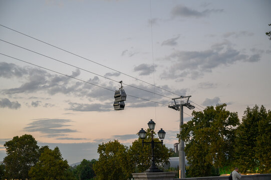 Cable Car and Vintage Streetlamp Against Evening Sky in Tbilisi