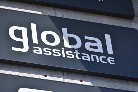 Global Assistance Polska insurance company office facade with signage, logo, emblem. WARSAW, POLAND - APRIL 18, 2026