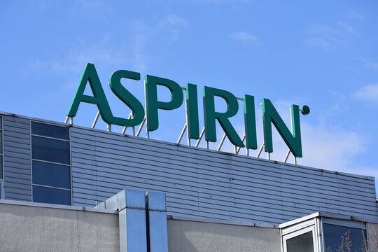 Aspirin signage on the roof of Bayer Polska building. WARSAW, POLAND - APRIL 18, 2026