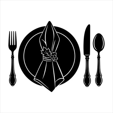 Formal dining place setting with folded napkin and classic cutlery