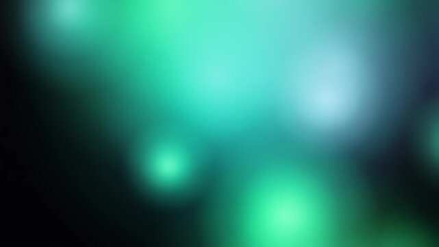 Soft glowing orbs of green and blue blend seamlessly on a dark background. The smooth gradient transitions create an ethereal, dreamy atmosphere with an emphasis on light diffusion and color harmony.