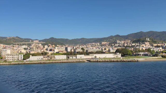 28 April 2026 Italy, Sicily, Strait of Messina, Agor&agrave; Dello Stretto - cruising alongside shoreline viewing Fiera di Messina with sightseeing Ficus magnolioide monumentale