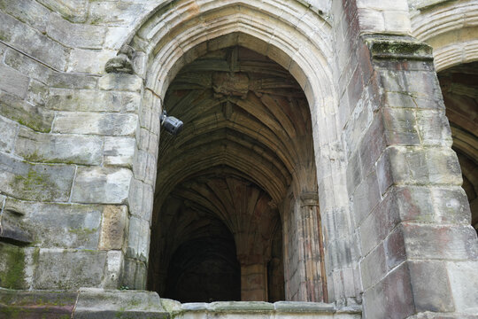 Vaulted stone passage inside a medieval well chapel in Wales