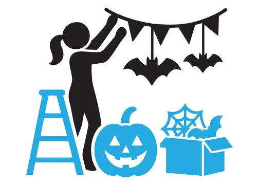 Woman hanging halloween decorations on a string with pumpkin and box of supplies
