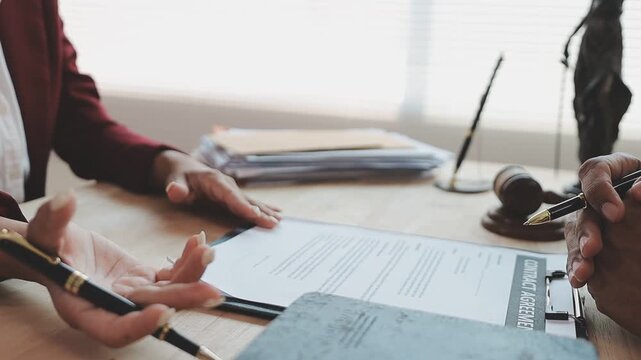 Lawyer explained to the client about the law that must be brought against the court case.