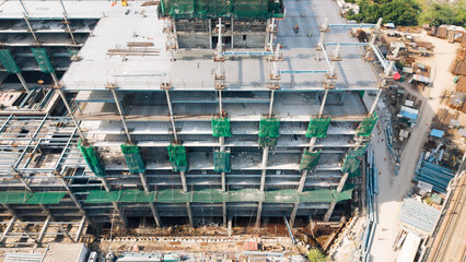 High rise building under construction with green safety netting aerial construction site industry © VisualTreat12