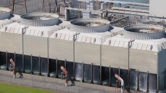 Industrial water cooling tower fans in operation at power plant