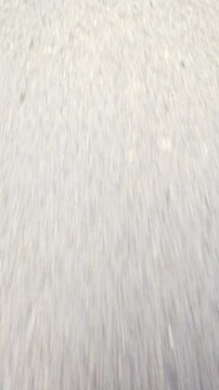 Fast Motion Vertical View of Asphalt Road Surface in Motion 4K