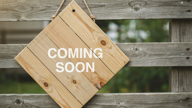 Wooden signboard hanging on fence indicating future availability