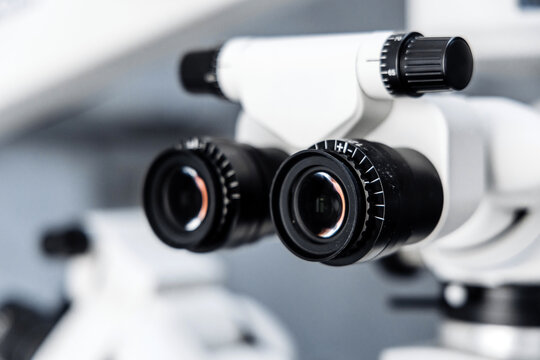 Close up of binocular eyepieces on ophthalmic surgical microscope, professional optics for precise eye surgery and cataract treatment.