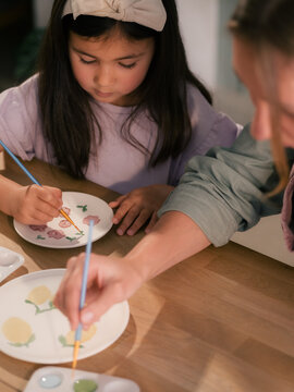 Mother and daughter painting
