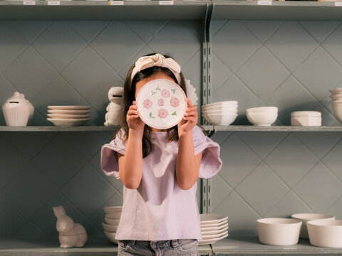 Girl showing her creation at studio