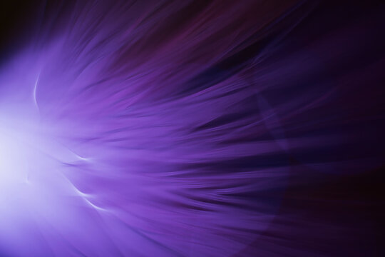 Light Spreads in Purple Tones in a Dark Environment