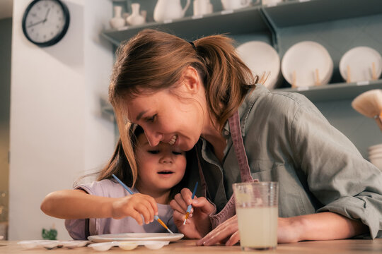 Mother and daughter bonding at workshop