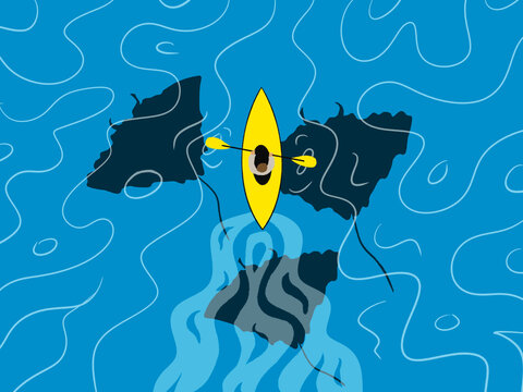 A kayaker floats above Manta Rays