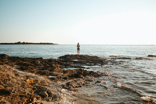 Solitary Figure on the Rocky Adriatic Coast