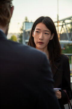 Business colleagues in discussion outdoors