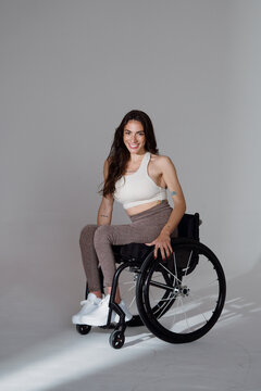 Young Woman in Wheelchair Smiling During Studio Photo Session