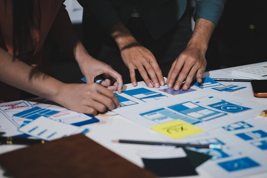 UI designer and UX developer brainstorm idea to design the application appearance in the early stage. Creative digital development agency. UX UI concept