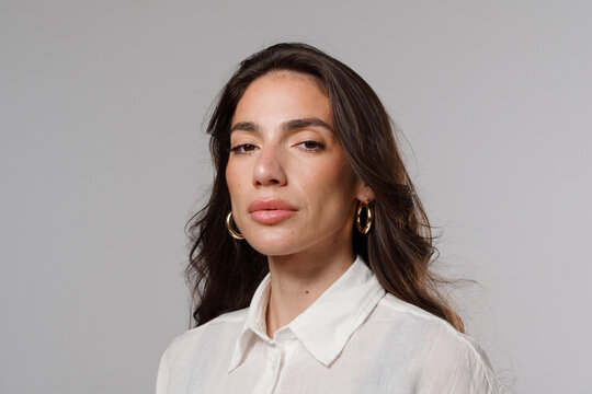 Portrait of a Person With Long Hair and Hoop Earrings