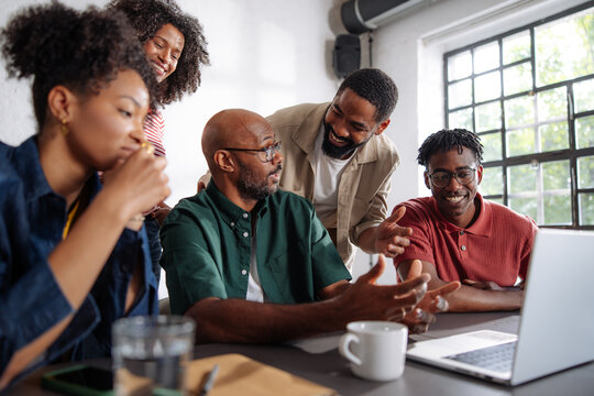 Diverse Team Collaborating in Casual Office Meeting