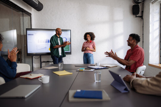 Business Team Meeting With Presentation And Applause