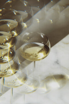 Stacked Glasses on a Marble Table With Reflections