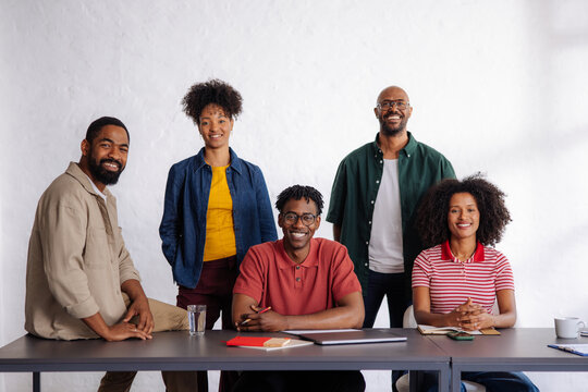 Smiling team of colleagues in a modern office