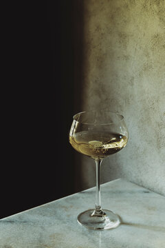 Glass of Drink on Marble Surface With Plain Background