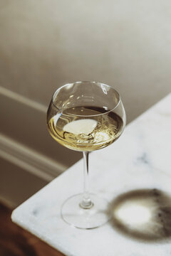 Wine Glass Placed on a Marble Table in a Bright Setting
