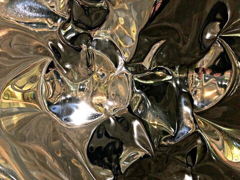 Abstract metallic surface with reflective distortions