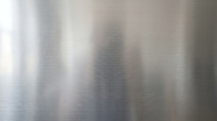 Brushed stainless steel metal sheet texture background for industrial design aesthetics.