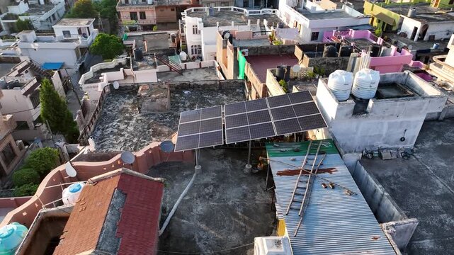 Solar Panel arrays on suburban houses in India, showcasing decentralized renewable energy adoption.