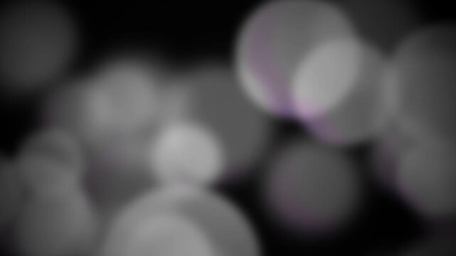Abstract blurred bokeh lights background in grayscale tones