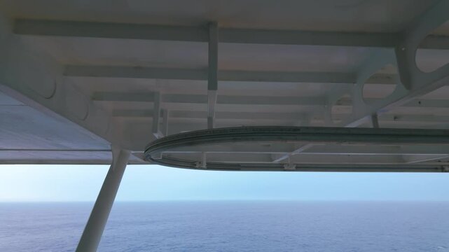 View of Open Ocean Horizon Framed by Cruise Ship Balcony Structure