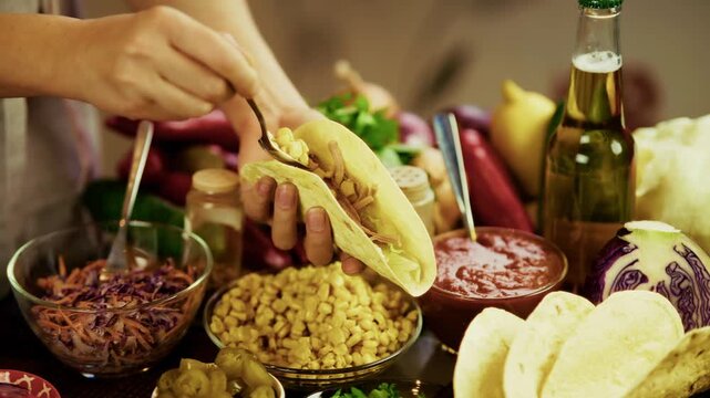 Chef Filling Corn Tortilla Shell With Ingredients Preparing Mexican Tacos. Food Street Snack 