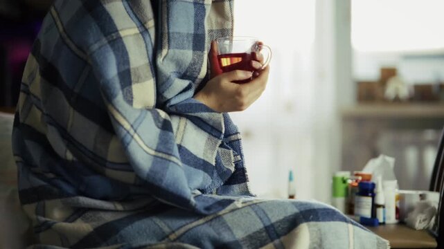Sick Patient Wrapped In Plaid Blanket Holding Cup Of Hot Tea. Cold And Influenza 