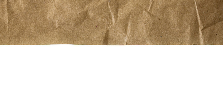 Torn crumpled brown paper cutout with jagged edge, natural kraft texture for background design element, transparent
