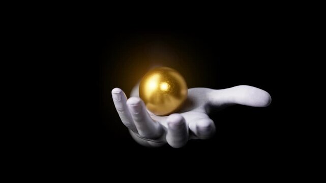 Looped animation of a hand emerging from darkness and opening to reveal a golden sphere. Dramatic luxury motion background for value, wealth, and premium concepts. 3d render motion.